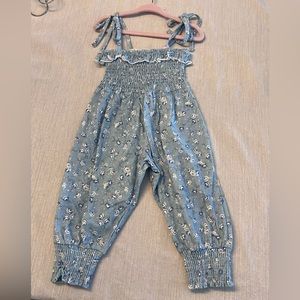 Smocked blue floral romper from Sweet Honey